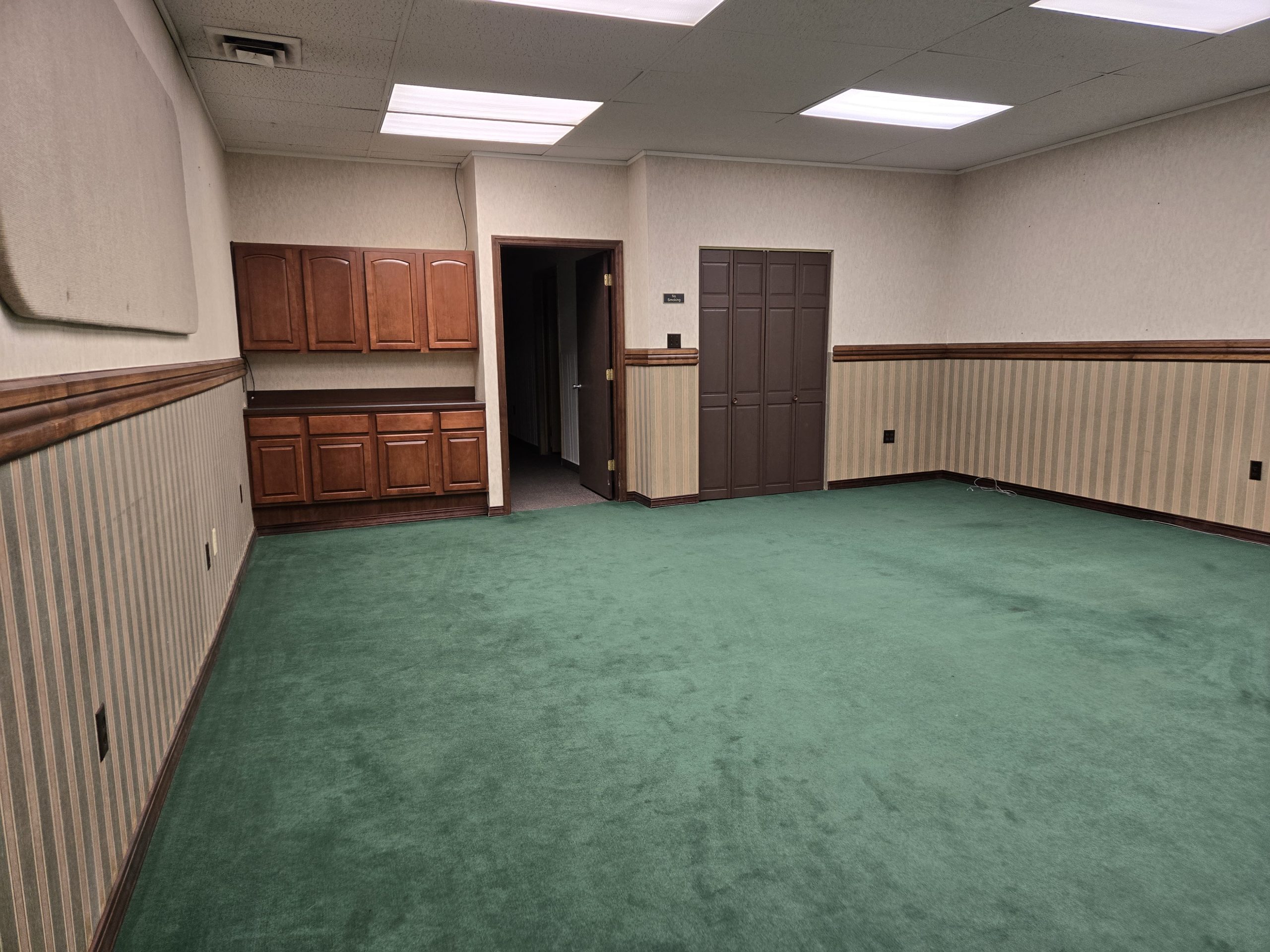 Suite 517 main room with open layout and ceiling lights at EVillage